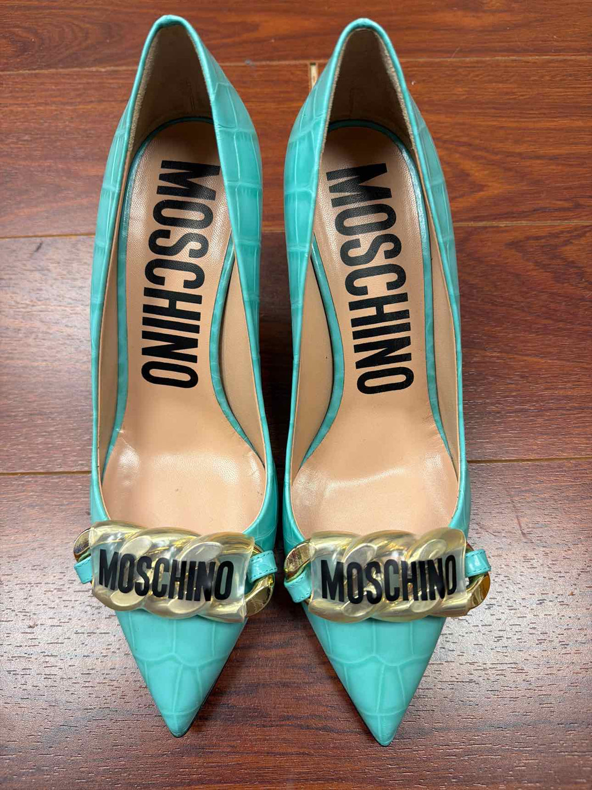 Teal Moschino croc print heels