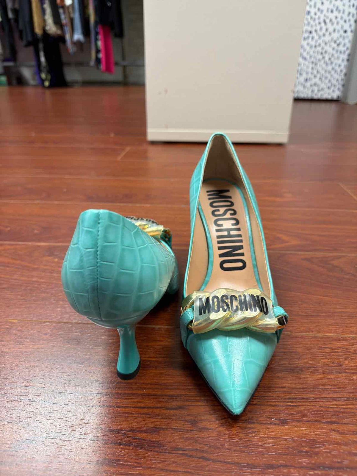 Teal Moschino croc print heels
