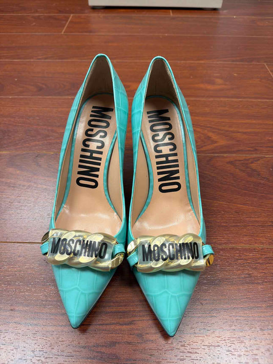 Teal Moschino croc print heels