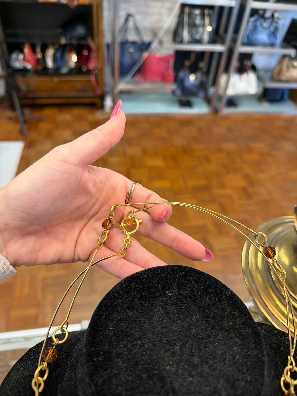 Gold necklace with brown beads and long
