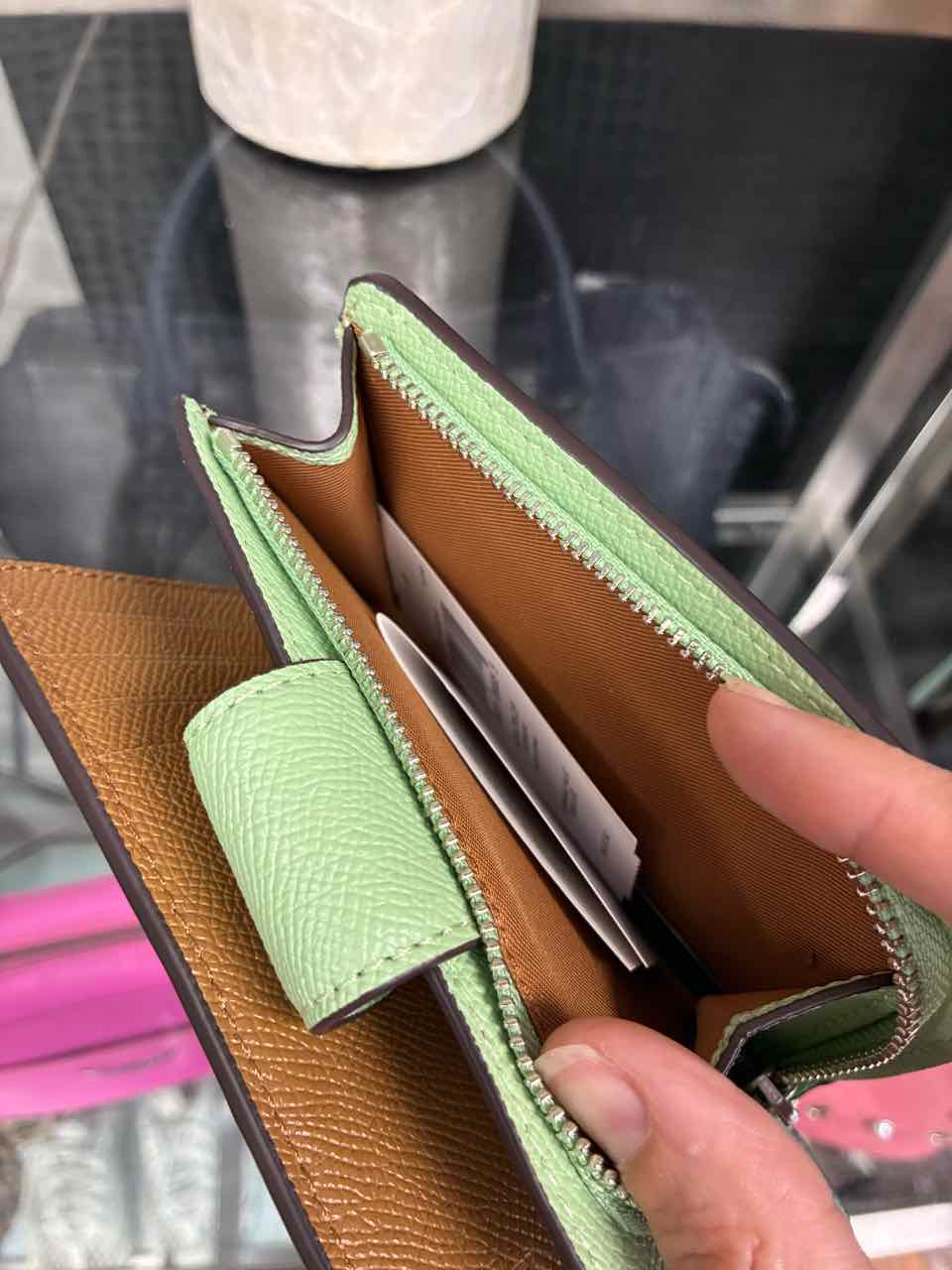 Coach Pistachio/green medium corner zip wallet in crossgrain leather.