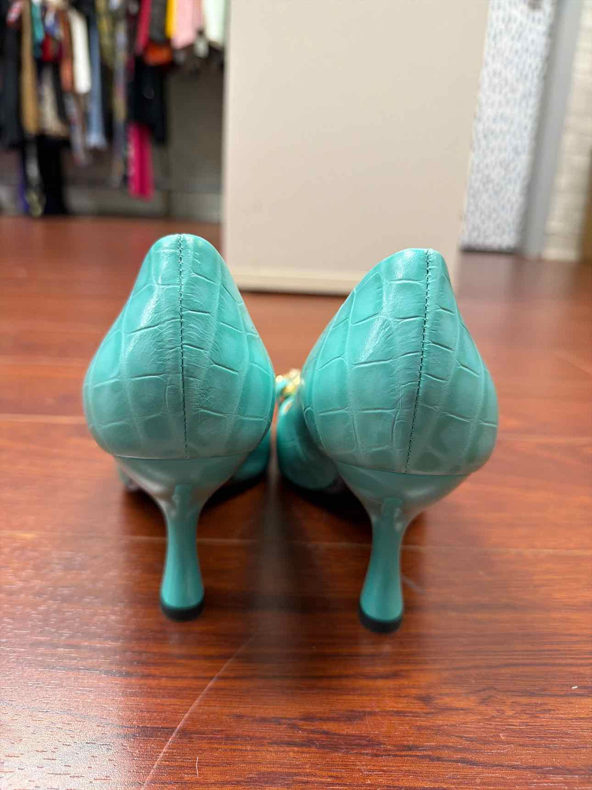 Teal Moschino croc print heels